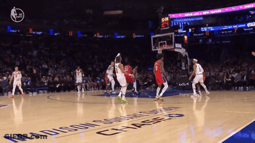 A Basketball Game Is Being Played On A Madison Square Garden Court GIF