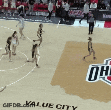 A Basketball Game Is Being Played On The Floor Of Value City GIF