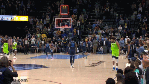 A Basketball Game Is Being Played With A Crowd Watching And The Score Is 0-0 GIF