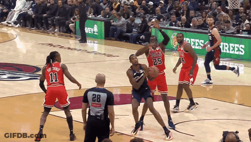 A Basketball Game Is Being Played With A Referee Wearing A Number 28 Jersey GIF