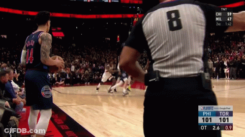 A Basketball Game Is Being Played With A Referee Wearing Number 8 GIF