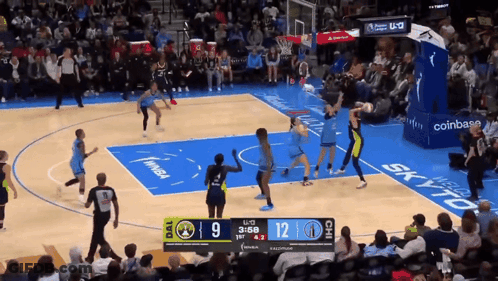 A Basketball Game Is Being Played With A Scoreboard Showing The Score At 12 To 9 GIF