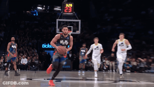 A Basketball Game Is Being Played With A Scoreboard That Says 339 On It GIF