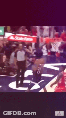 A Basketball Game Is Being Played With A State Farm Banner In The Background GIF