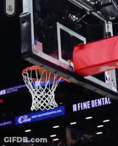 A Basketball Going Through A Net With A Fine Dental Sign Behind It GIF