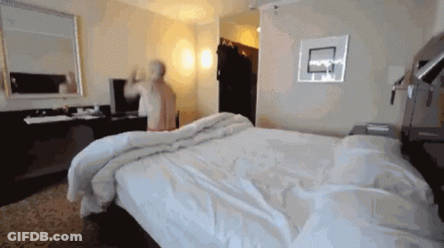 A Basketball Hoop Is On The Wall Above A Bed GIF