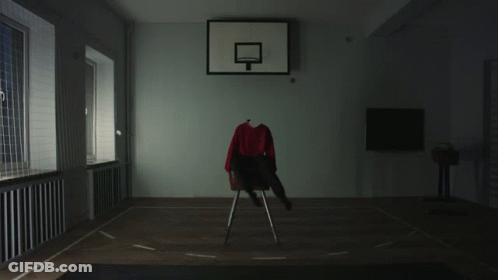 A Basketball Hoop With A Red Shirt On A Chair In Front Of It GIF