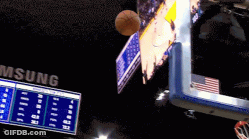 A Basketball Is Flying Through The Air In Front Of A Scoreboard That Says Samsung GIF