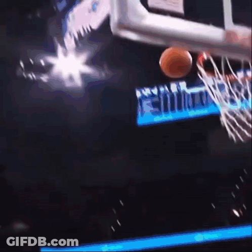 A Basketball Is Going Through A Hoop With A Sign That Says Miami On It GIF