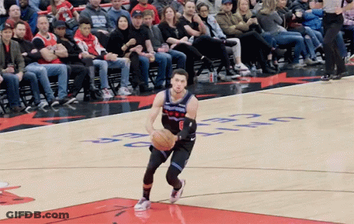 A Basketball Player Dribbles A Ball On A Court With The Word Celtics On It GIF