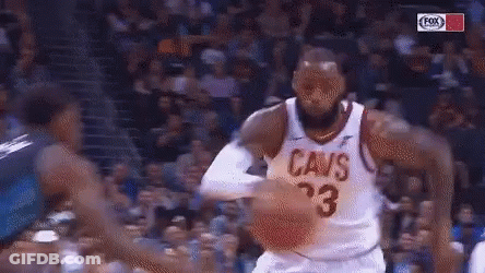 A Basketball Player For The Cavs Dribbles The Ball During A Game GIF