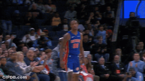 A Basketball Player For The Detroit Pistons Stands In Front Of The Crowd GIF