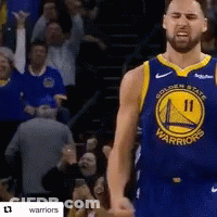 A Basketball Player For The Golden State Warriors Is Standing In Front Of A Crowd GIF