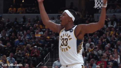 A Basketball Player For The Indiana Pacers Celebrates With His Arms In The Air GIF