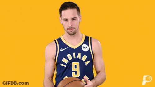A Basketball Player For The Indiana Pacers Holds A Basketball GIF