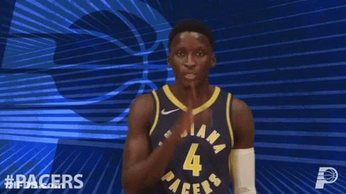 A Basketball Player For The Indiana Pacers Holds His Hand To His Mouth GIF