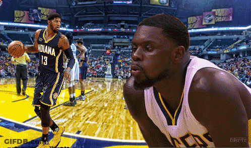 A Basketball Player For The Indiana Pacers Is Holding A Basketball GIF