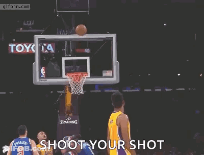A Basketball Player For The Lakers Is Jumping In The Air With His Arms Outstretched GIF
