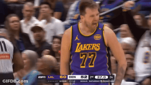 A Basketball Player For The Lakers Is Standing In Front Of A Crowd GIF