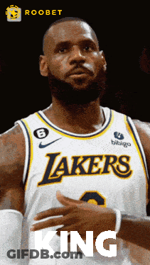 A Basketball Player For The Lakers Is Wearing A White Jersey GIF