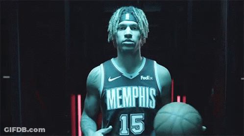A Basketball Player For The Memphis Grizzlies Holds A Basketball GIF