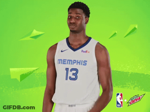 A Basketball Player For The Memphis Grizzlies Poses For A Picture GIF