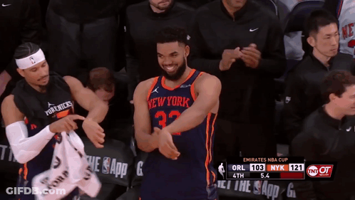 A Basketball Player For The New York Knicks Is Clapping His Hands GIF