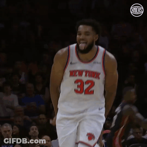 A Basketball Player For The New York Knicks Is Standing On The Court GIF