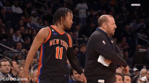 A Basketball Player For The New York Knicks Is Talking To His Coach GIF