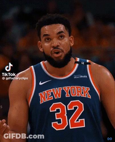 A Basketball Player For The New York Knicks Is Wearing A Blue Jersey With The Number 32 On It GIF
