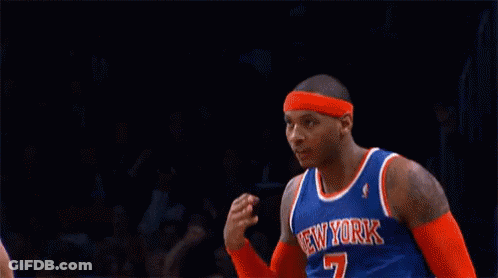 A Basketball Player For The New York Knicks Salutes During A Game GIF