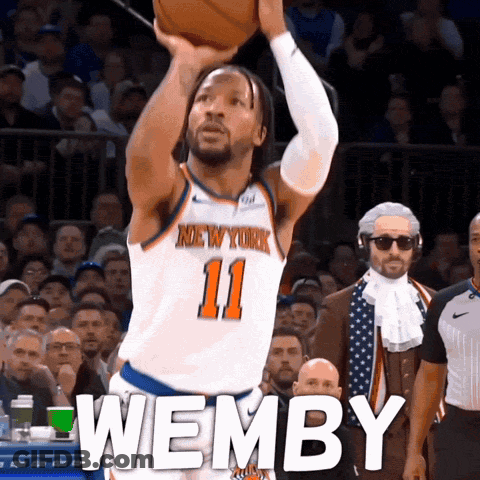 A Basketball Player For The New York Knicks Shoots A Ball GIF
