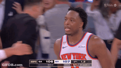 A Basketball Player For The New York Knicks Stands In Front Of A Crowd During A Game GIF