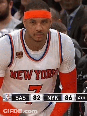 A Basketball Player For The New York Knicks Wears An Orange Headband During A Game GIF