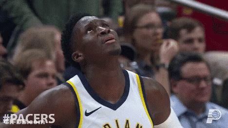 A Basketball Player For The Pacers Looks Up In The Air GIF