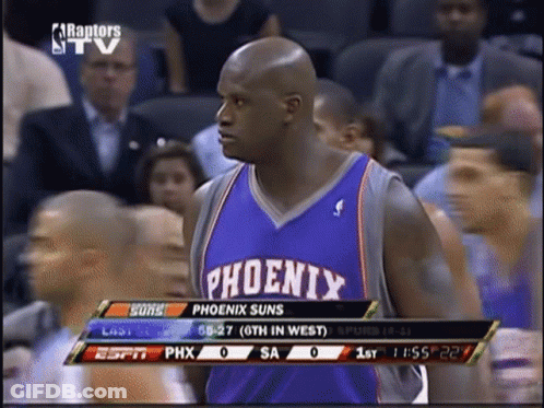 A Basketball Player For The Phoenix Suns Is Standing In Front Of A Crowd GIF