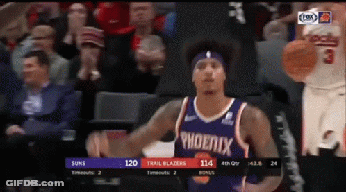 A Basketball Player For The Phoenix Trail Blazers Is Dribbling A Basketball GIF