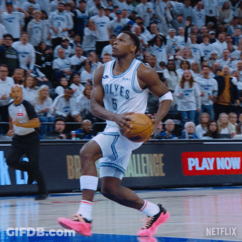 A Basketball Player For The Wolves Is Dribbling A Basketball GIF