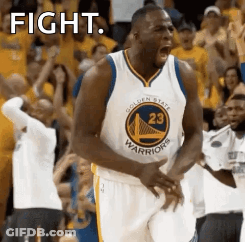 A Basketball Player From The Golden State Warriors Is Screaming In The Stands During A Game . GIF
