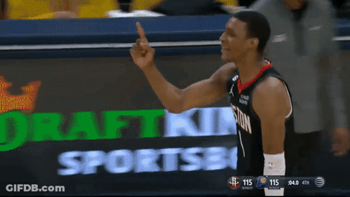 A Basketball Player Giving A Middle Finger In Front Of A Scoreboard GIF