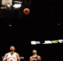 A Basketball Player Going For A Dunk In Front Of A Sign That Says 15 GIF