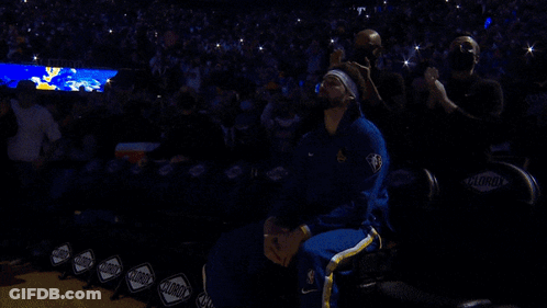 A Basketball Player In A Blue And Gold Uniform Stands On The Court GIF