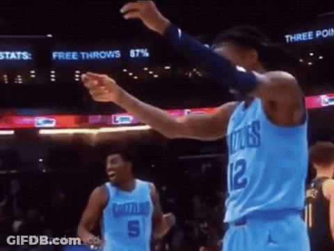 A Basketball Player In A Blue Jersey With The Number 12 On The Back GIF