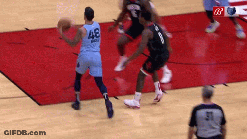 A Basketball Player In A Blue Jersey With The Number 46 On It Is Dribbling The Ball . GIF