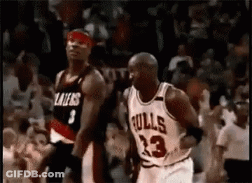 A Basketball Player In A Bulls Jersey Is Dribbling A Basketball While Another Player Tries To Stop Him . GIF