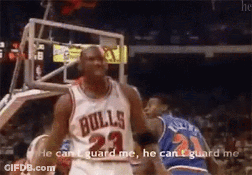 A Basketball Player In A Bulls Jersey Is Talking To Another Player . GIF