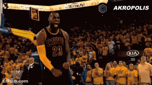 A Basketball Player In A Cavs Jersey Celebrates In Front Of A Crowd GIF