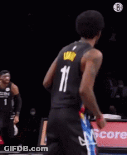 A Basketball Player In A Cavs Jersey Is Dancing On The Court GIF