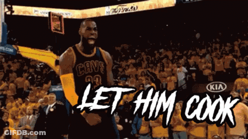A Basketball Player In A Cavs Jersey Stands In Front Of A Crowd And Says Let Him Cook GIF