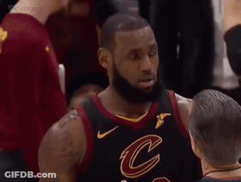 A Basketball Player In A Cleveland Cavaliers Jersey Is Talking To Another Player . GIF